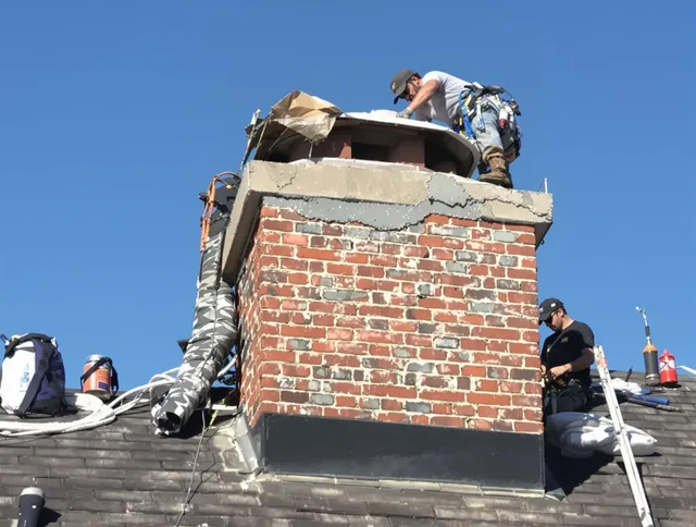 Fontana Chimney Sweep installing a custom chimney crown in Fontana, CA