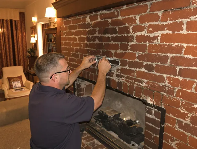 Fontana Chimney Sweep expert fixing a fireplace in Fontana, CA